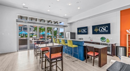 Resident Lounge with kitchen and bar top seating 