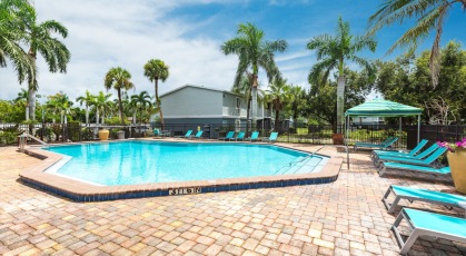 Swimming Pool with Lounge seating and umbrellas