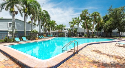 Swimming Pool with Lounge seating and umbrellas