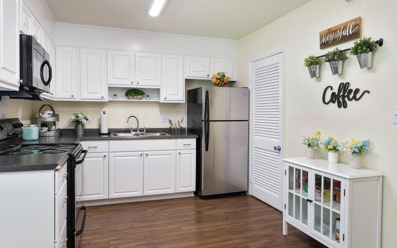 a kitchen with white cabinets