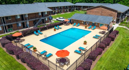 Sparkling pool surrounded by adjustable lounge chairs