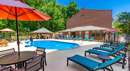 Swimming pool with cabana and lounge chairs 