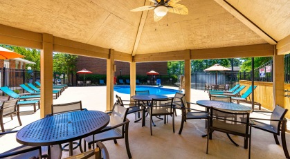 Swimming pool with cabana and lounge chairs 