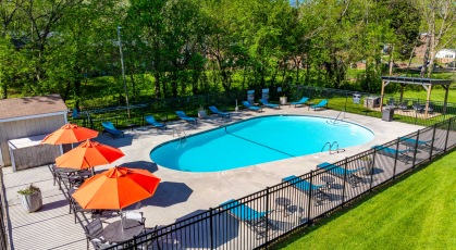 Swimming pool with lounge chairs and umbrellas
