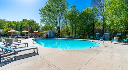 Swimming pool with lounge chairs and umbrellas