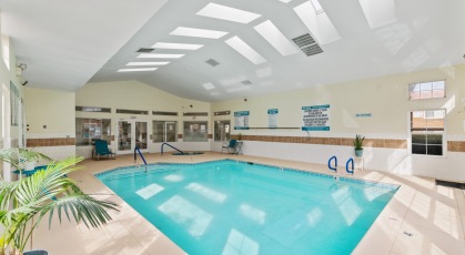 Indoor pool and jacuzzi rests adjacent to clubhouse