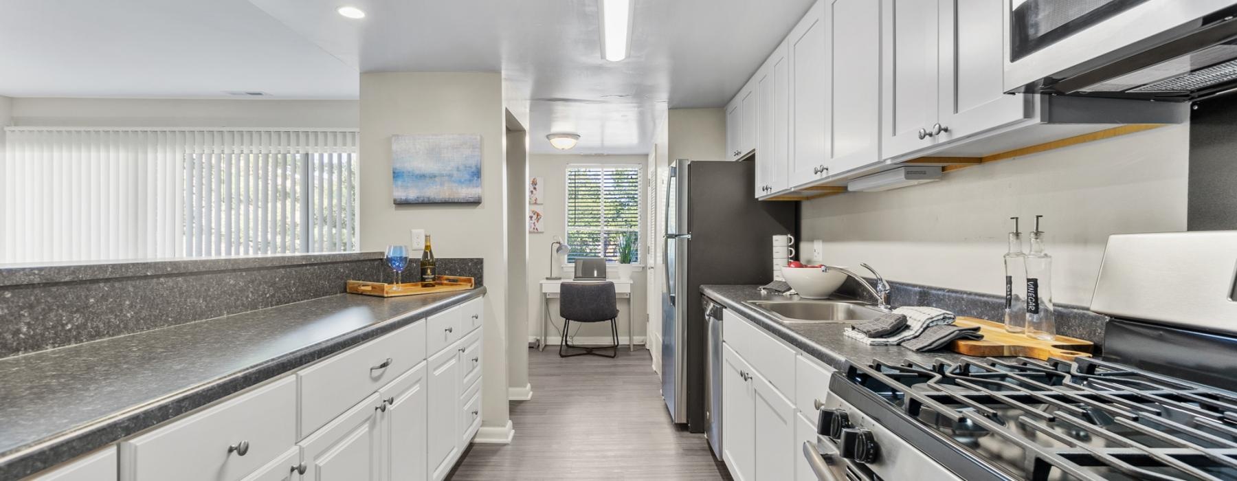 a kitchen with white cabinets
