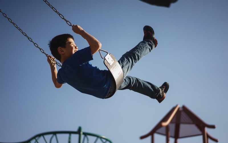 a boy on a swing
