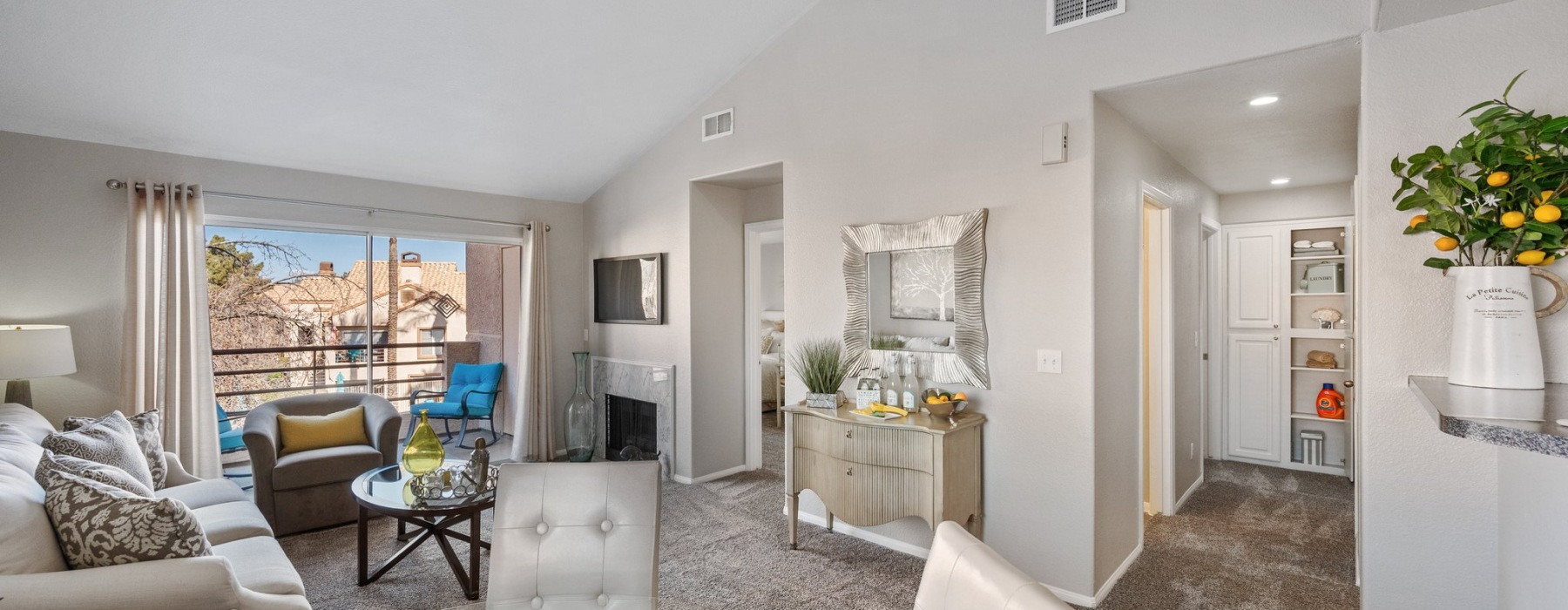 open layout living room, dining area and kitchen counter stool area