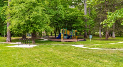 Large trees and beautiful greenery by the outdoor playground