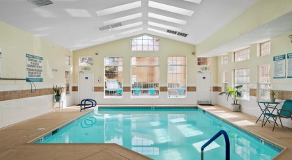 Indoor pool and jacuzzi rests adjacent to clubhouse