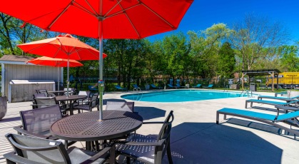 Swimming pool with umbrellas, tables and lounge seating
