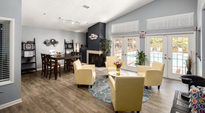 Resident lounge with tall table and lounge style chairs