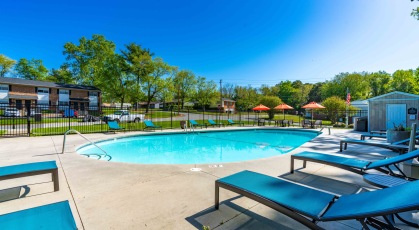 Swimming pool with lounge chairs and umbrellas