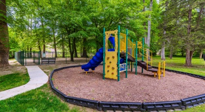 Large trees and beautiful greenery by the outdoor playground