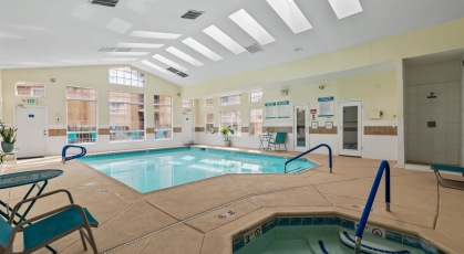Indoor pool and jacuzzi rests adjacent to clubhouse