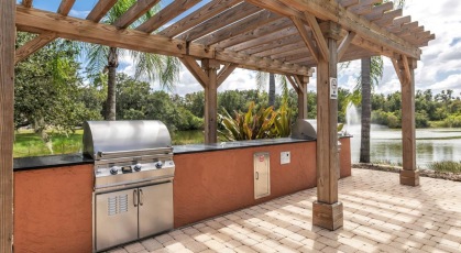 Covered grill area near pool and lake Brandon