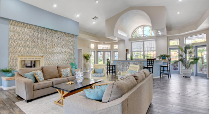 Luxurious clubhouse brightly lit with kitchen 