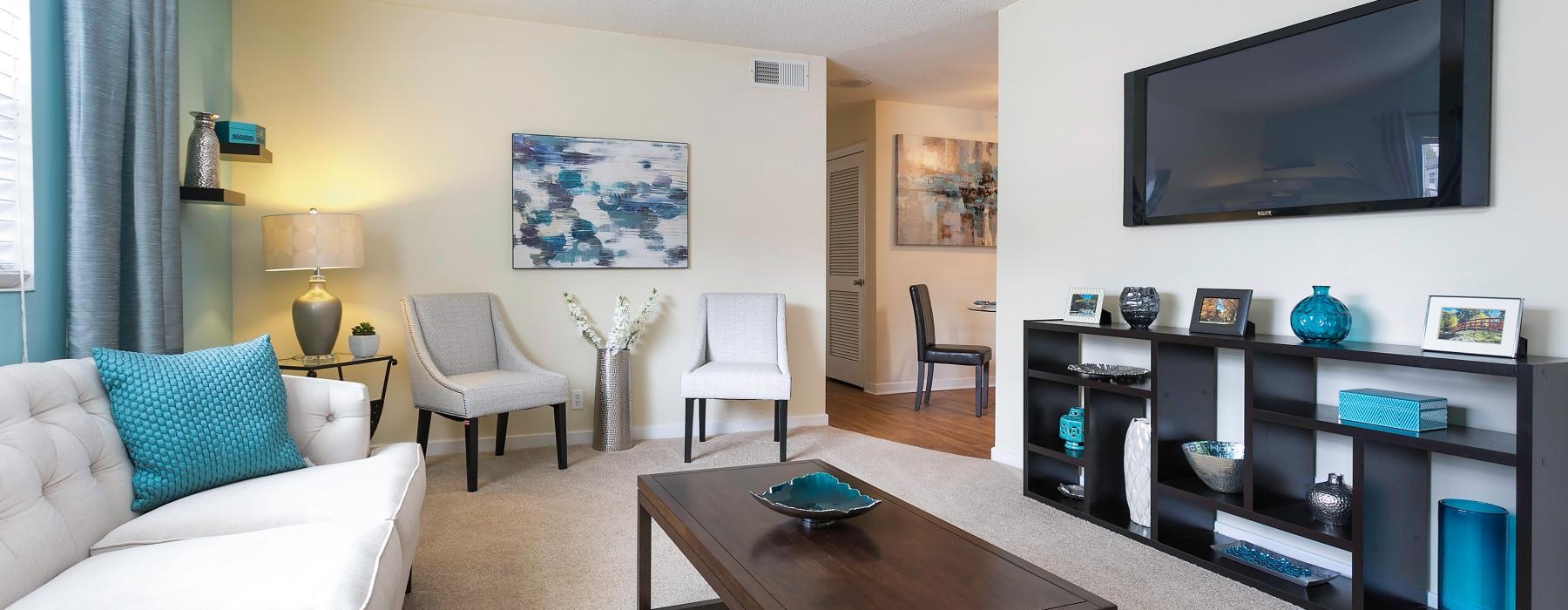 a living room with a tv and couches