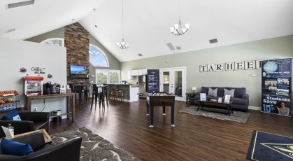 Clubhouse with seating, foosball table and fireplace