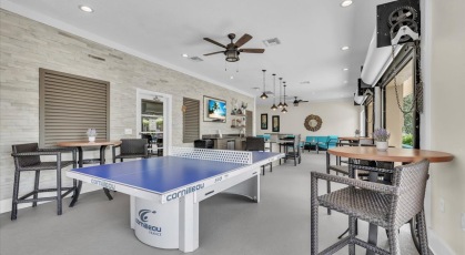Resident game room with tabletop tennis and high top seating