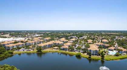 Serene lakeside walking trail around community lake