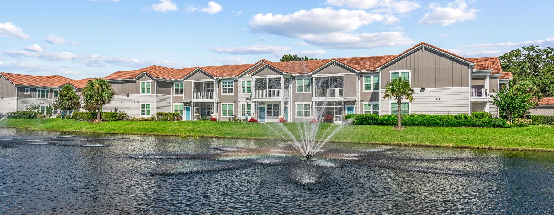 a building with a pond in front of it