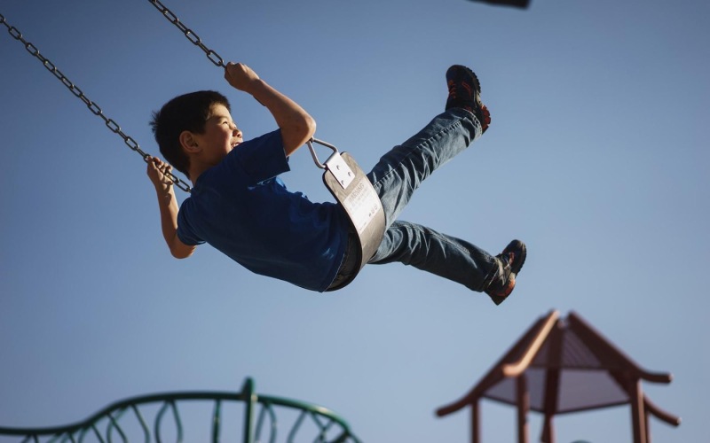 a boy on a swing