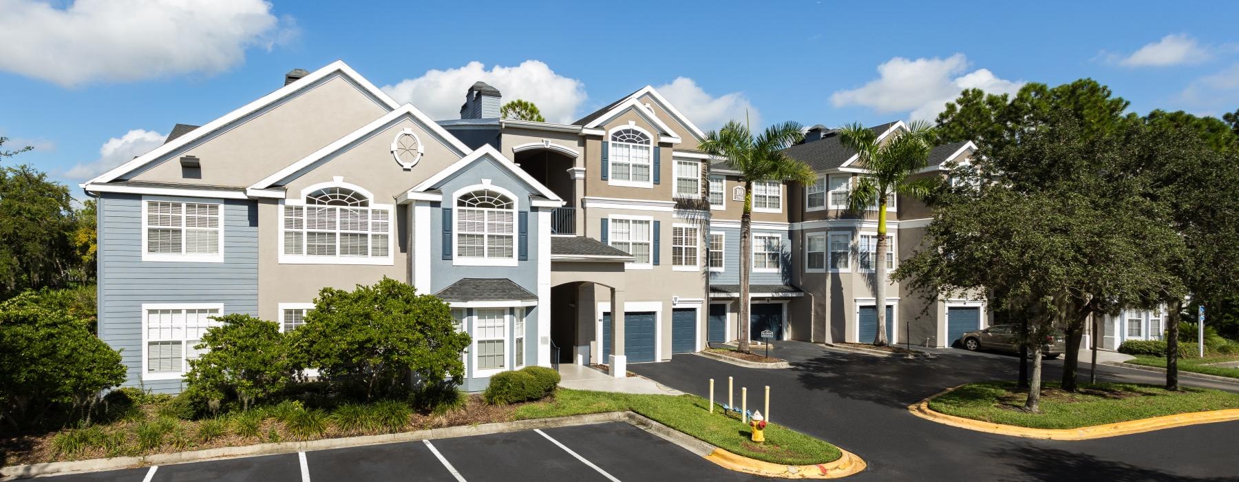 parking lot in front of apartment homes