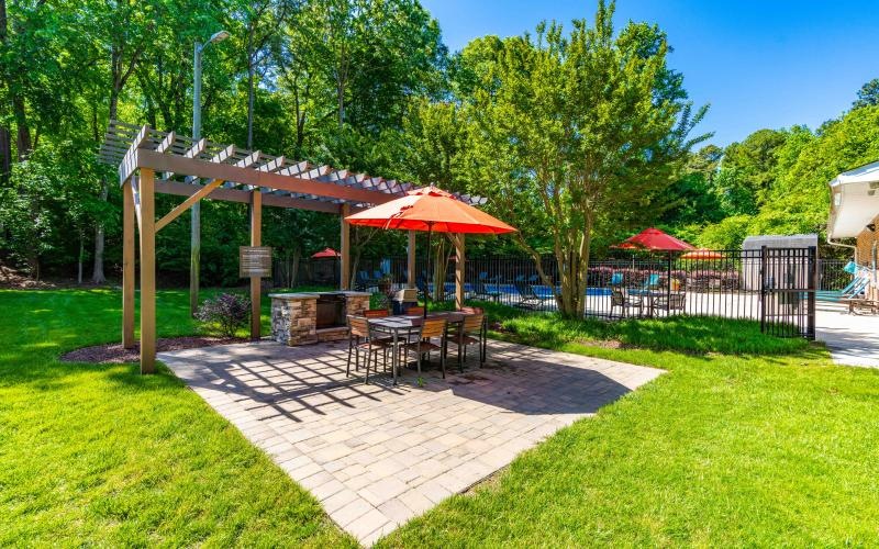a patio with tables and chairs