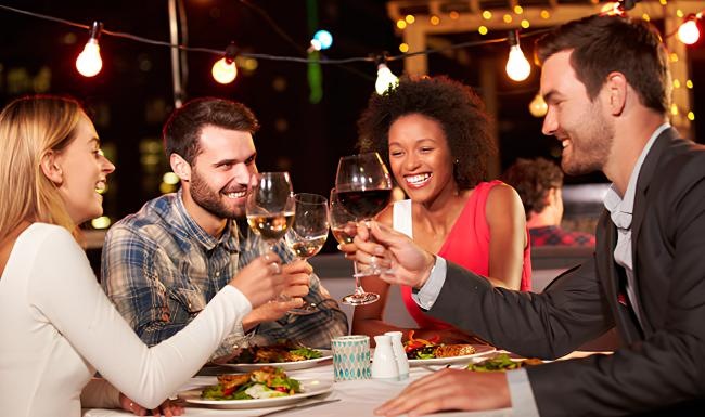 a group of people having a meal
