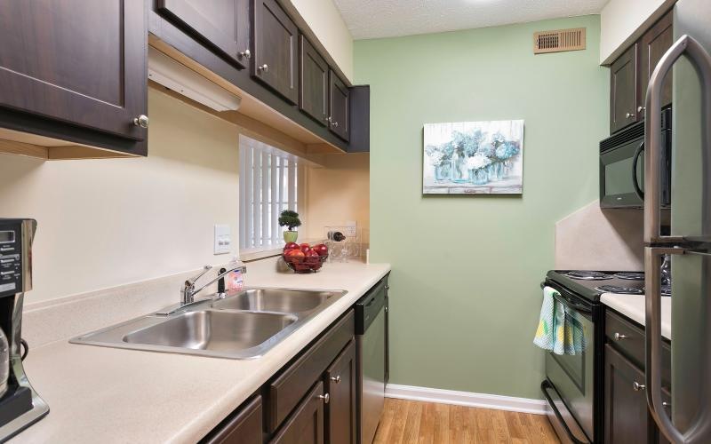 a kitchen with a sink and cabinets