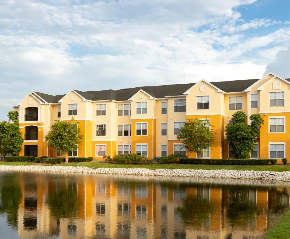 a building with a pond in front of it