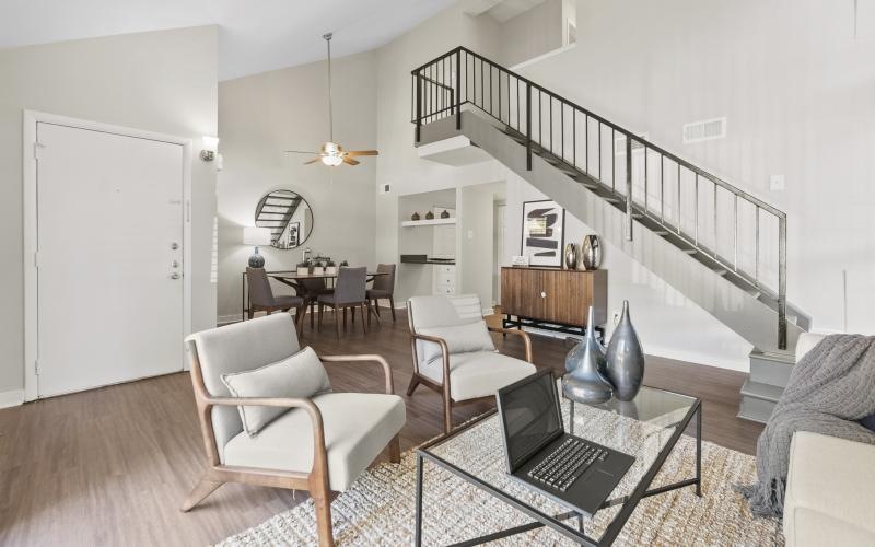 a living room with a staircase