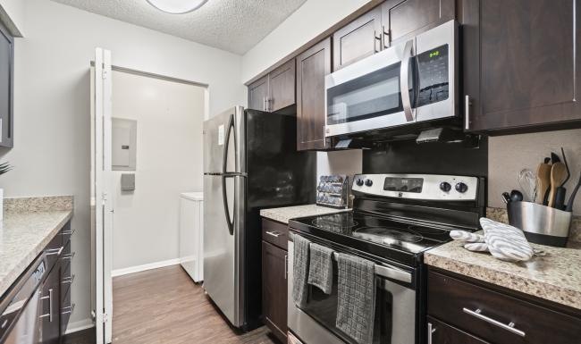 a kitchen with black appliances
