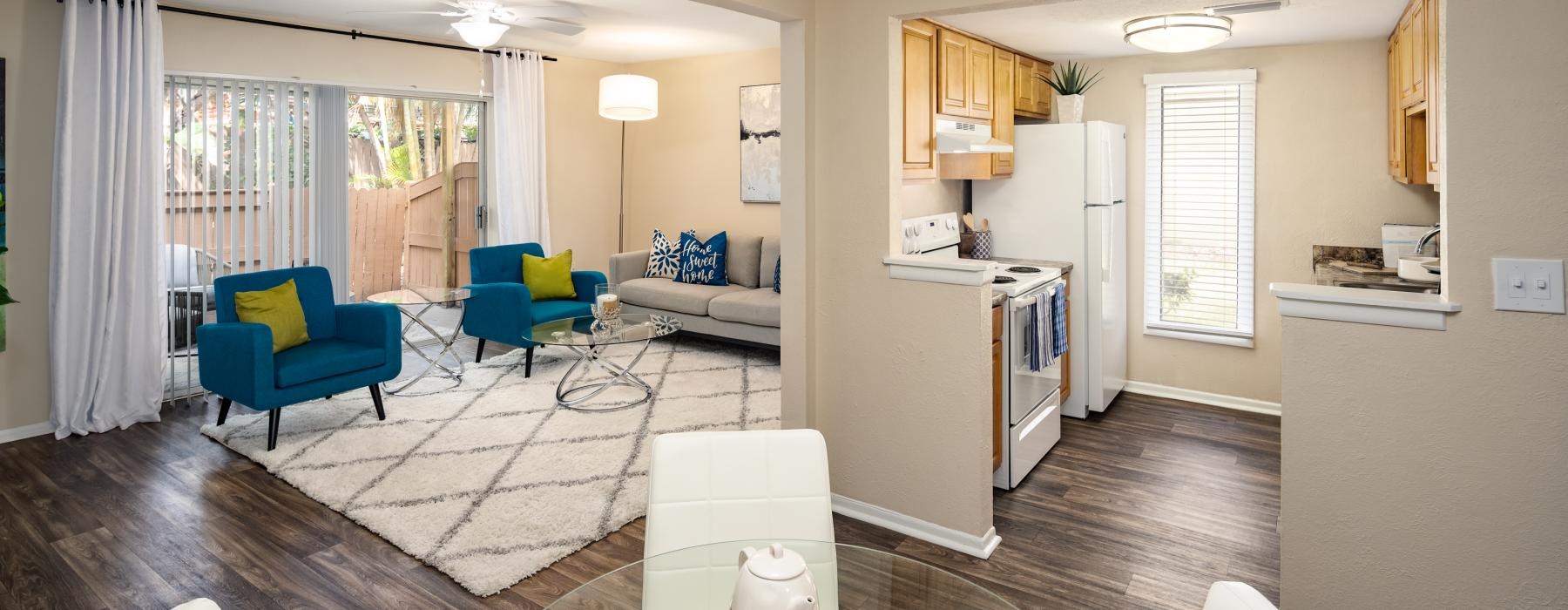 a living room with a dining table and chairs