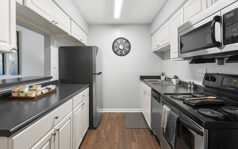 a kitchen with a stove and oven