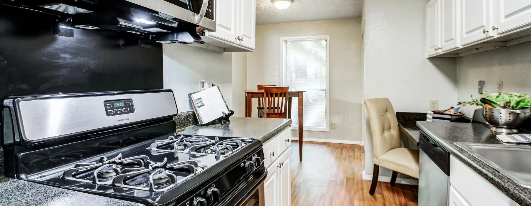 a kitchen with a stove and oven