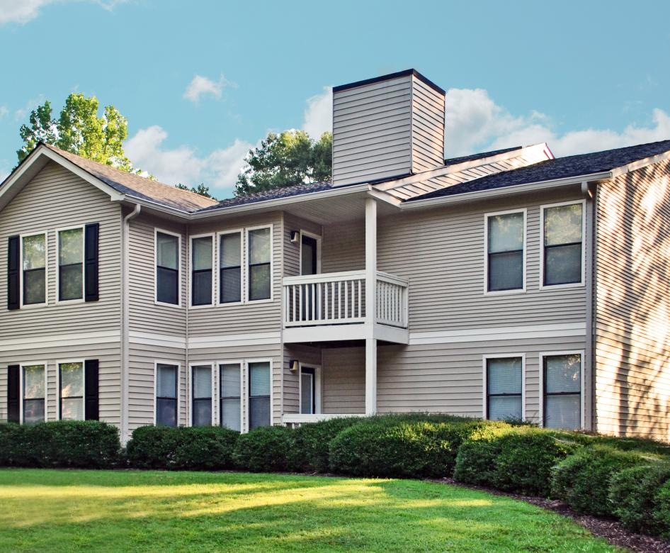a large house with a lawn in front of it