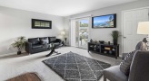 Living Room with large glass patio doors and lots of natural light