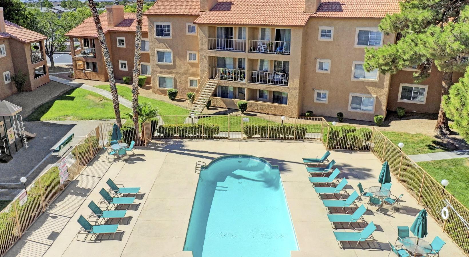 Aerial view of second, gated, pool is centrally situated on the property