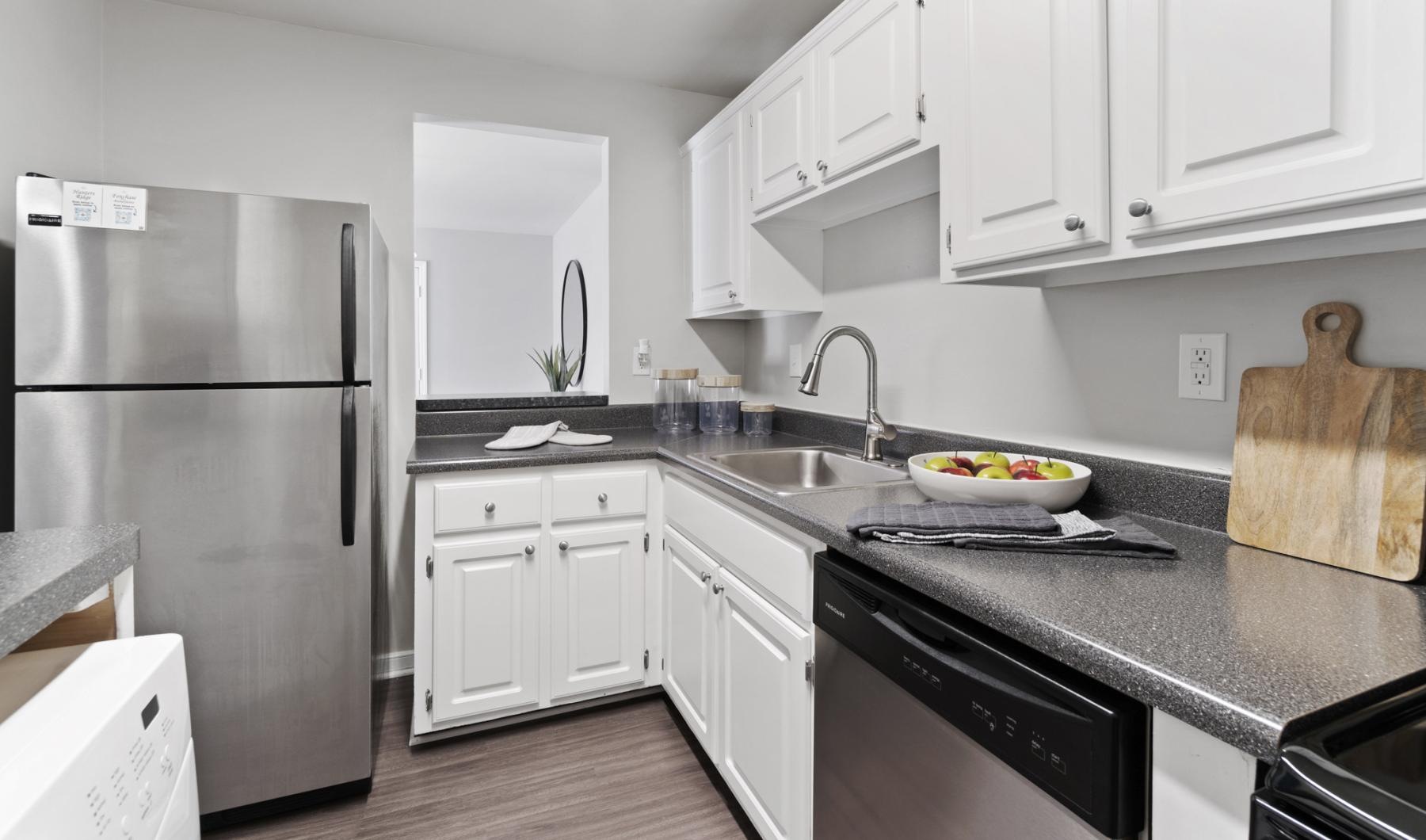 a kitchen with white cabinets