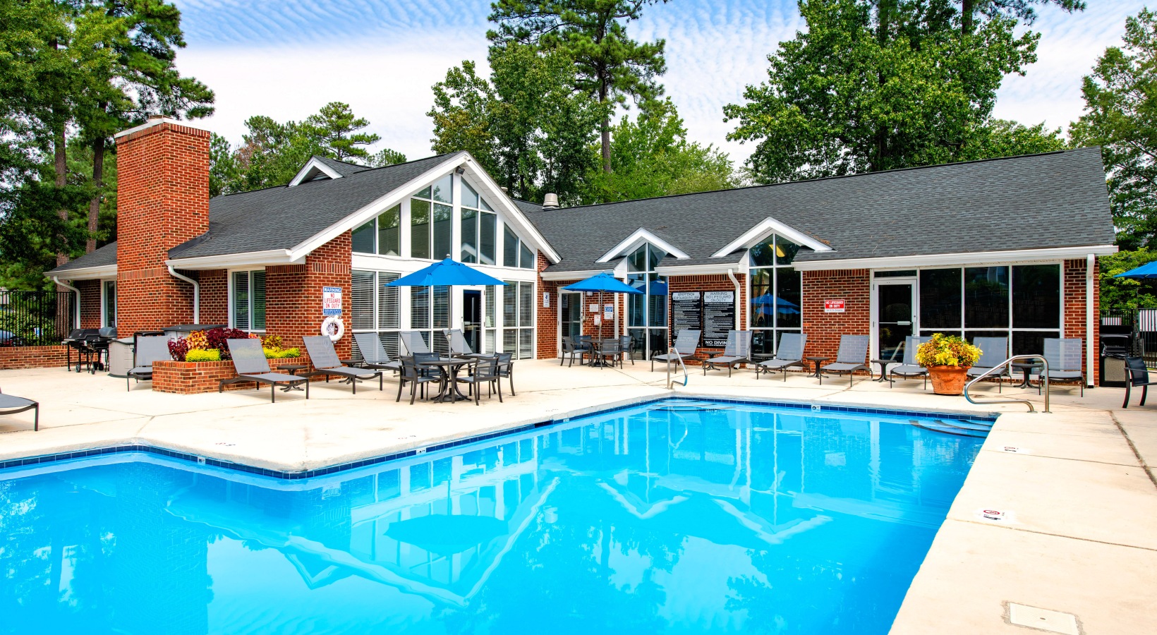 Sparkling swimming pool and lounge chairs