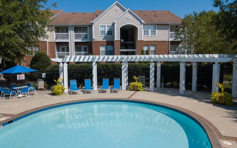 a pool with a building in the background