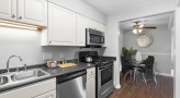 Kitchen with stainless steel appliances and built-in microwave