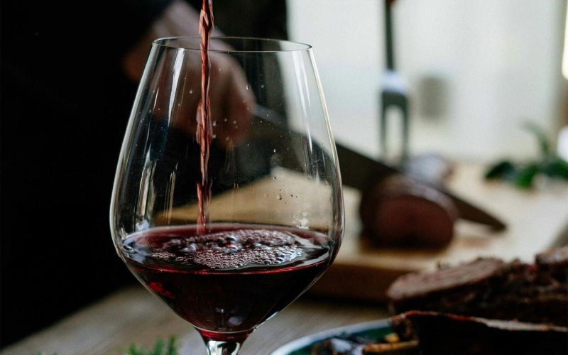 a glass of wine on a table