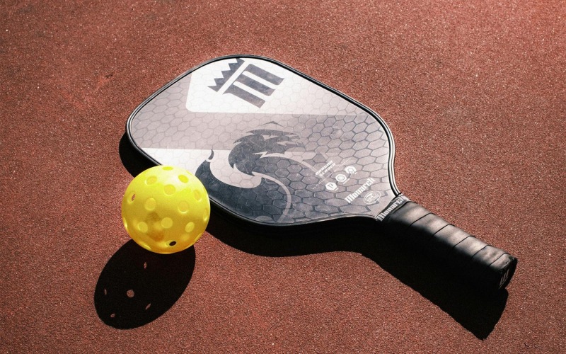 a Pickleball ball and a racket