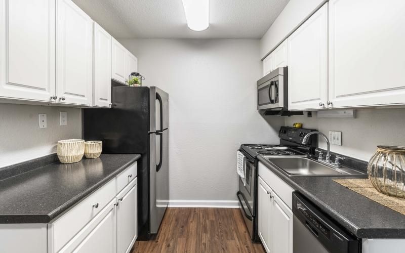 a kitchen with white cabinets