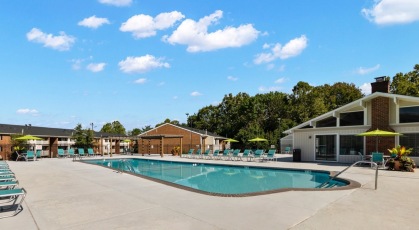 Large swimming pool and sundeck at the leasing office