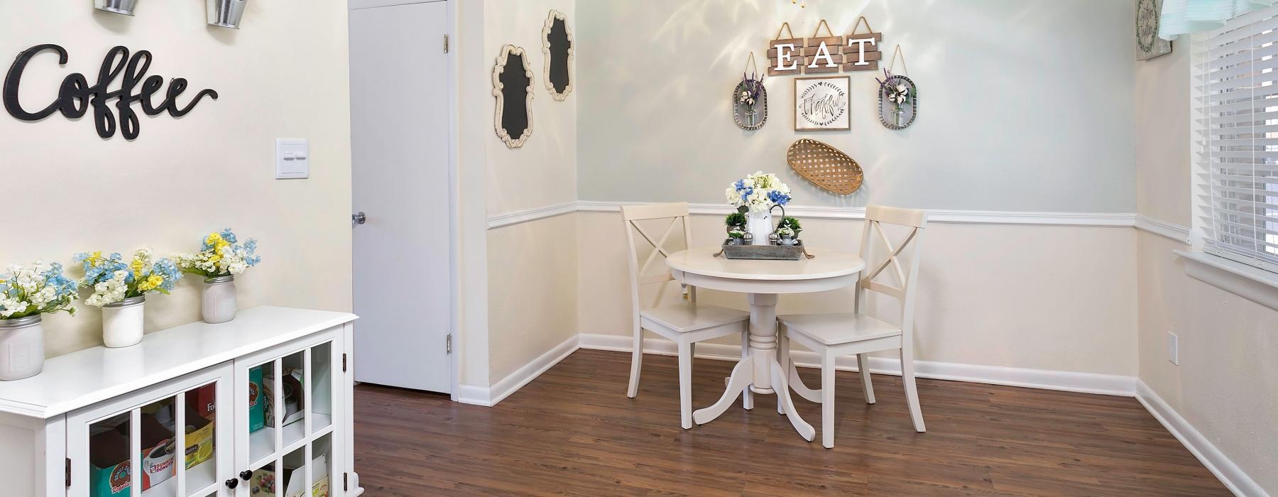 a room with a table and chairs